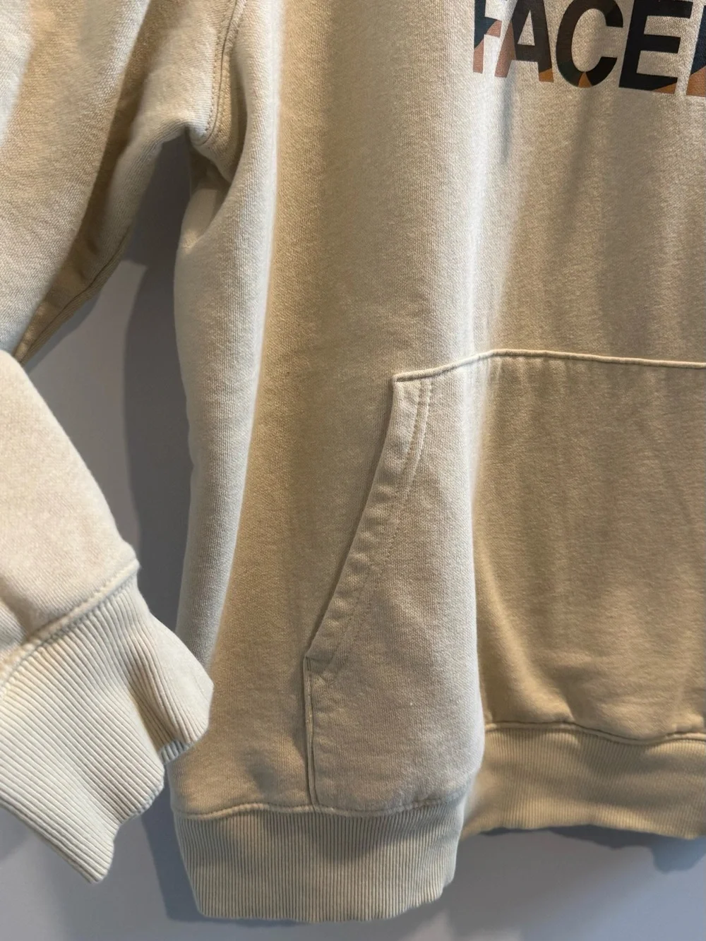 The North Face Men's Cream Logo Pullover Hoodie with Multicolor Logo